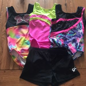 3 gymnastic leotards and 1 gymnastic shorts